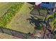 Landscaped backyard with a fence at 5658 Del Coronado Dr, Apollo Beach, FL 33572