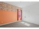 Bedroom with floral wallpaper and coral accent wall at 5658 Del Coronado Dr, Apollo Beach, FL 33572
