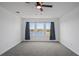 Bright bedroom with lake view and grey carpet at 5658 Del Coronado Dr, Apollo Beach, FL 33572