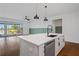 White shaker cabinets, quartz countertops, and a large island at 5658 Del Coronado Dr, Apollo Beach, FL 33572