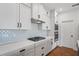 Modern kitchen with stainless steel appliances and a large island at 5658 Del Coronado Dr, Apollo Beach, FL 33572