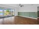 Living area with wood floors and sliding doors to a patio at 5658 Del Coronado Dr, Apollo Beach, FL 33572