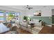 Bright living room with access to a patio and view of a lake at 5658 Del Coronado Dr, Apollo Beach, FL 33572