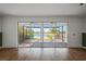 Living room with sliding doors leading to a patio and lake view at 5658 Del Coronado Dr, Apollo Beach, FL 33572