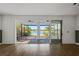 Living room with sliding doors leading to a patio and lake view at 5658 Del Coronado Dr, Apollo Beach, FL 33572