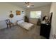 Simple bedroom with a twin-size bed and a window at 5730 16Th Ne Ln, St Petersburg, FL 33703