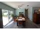 Bright dining area with hardwood floors and access to the backyard at 5730 16Th Ne Ln, St Petersburg, FL 33703