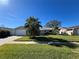 Single story home with attached garage and spacious lawn at 5730 16Th Ne Ln, St Petersburg, FL 33703