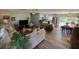 Open living area with hardwood floors, updated kitchen, and pool view at 5730 16Th Ne Ln, St Petersburg, FL 33703