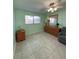 Bedroom with tiled floors, dresser, and ceiling fan at 5895 18Th N St # 9, St Petersburg, FL 33714