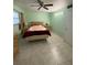 Spacious bedroom with tiled floors and ceiling fan at 5895 18Th N St # 9, St Petersburg, FL 33714