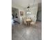 Cozy dining area with a four-person table and chairs at 5895 18Th N St # 9, St Petersburg, FL 33714