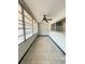 Enclosed patio with tiled floor and ceiling fan at 5895 18Th N St # 9, St Petersburg, FL 33714