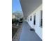 Exterior view showing condo building with walkway and landscaping at 5895 18Th N St # 9, St Petersburg, FL 33714