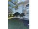 Side view of condo building showcasing landscaping and building exterior at 5895 18Th N St # 9, St Petersburg, FL 33714