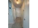 Clean hallway with tiled floors and neutral walls at 5895 18Th N St # 9, St Petersburg, FL 33714