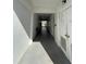 Clean and well-lit hallway with tiled floors and a bench at 5895 18Th N St # 9, St Petersburg, FL 33714