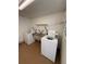 Shared laundry room with two washers and a double sink at 5895 18Th N St # 9, St Petersburg, FL 33714