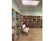 Well-stocked library with a variety of books and a comfy chair at 5895 18Th N St # 9, St Petersburg, FL 33714