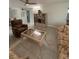 Living room featuring tiled floors, sofas, and a coffee table at 5895 18Th N St # 9, St Petersburg, FL 33714