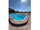 Refreshing community pool with surrounding patio at 5895 18Th N St # 9, St Petersburg, FL 33714