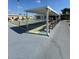 Outdoor shuffleboard courts with covered seating areas at 5895 18Th N St # 9, St Petersburg, FL 33714
