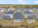 Aerial view of houses with gray roofs and fenced backyards at 5936 Golden Nettle Dr, Apollo Beach, FL 33572