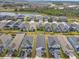 Aerial view of community with houses and a lake at 5936 Golden Nettle Dr, Apollo Beach, FL 33572