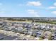 Aerial view of houses and neighborhood with a lake at 5936 Golden Nettle Dr, Apollo Beach, FL 33572
