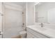 Clean bathroom with white vanity, quartz countertop, and tile shower at 5936 Golden Nettle Dr, Apollo Beach, FL 33572