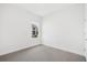Bright bedroom with neutral colored walls and carpet flooring at 5936 Golden Nettle Dr, Apollo Beach, FL 33572