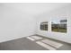 Spacious bedroom with two windows and grey carpet at 5936 Golden Nettle Dr, Apollo Beach, FL 33572