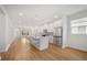 Open concept kitchen with white cabinets and island at 5936 Golden Nettle Dr, Apollo Beach, FL 33572
