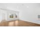 Spacious living room with hardwood floors and large windows at 5936 Golden Nettle Dr, Apollo Beach, FL 33572