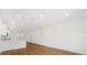 Open living room and kitchen area with light wood floors at 5936 Golden Nettle Dr, Apollo Beach, FL 33572