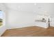 Spacious living room with kitchen view and large window at 5936 Golden Nettle Dr, Apollo Beach, FL 33572