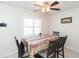 Dining area with a table set for four and plantation shutters at 6501 Cedarbrook S Dr, Pinellas Park, FL 33782