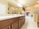 Bright bathroom with double sinks, spacious vanity, and a soaking tub with a shower at 6722 Boulder Run Loop, Wesley Chapel, FL 33545