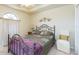 Cozy bedroom with decorative iron bed frame and bright natural light at 6722 Boulder Run Loop, Wesley Chapel, FL 33545