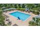 Aerial view of a large, rectangular community pool with lounge chairs and seating areas at 6722 Boulder Run Loop, Wesley Chapel, FL 33545