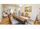 Open concept dining room featuring hardwood floors, elegant decor, and seamless flow into the adjacent living space at 6722 Boulder Run Loop, Wesley Chapel, FL 33545