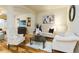 Bright living room with light colored furnishings and hardwood flooring at 6722 Boulder Run Loop, Wesley Chapel, FL 33545