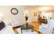 Living room with hardwood floors that opens to a dining area with chandelier at 6722 Boulder Run Loop, Wesley Chapel, FL 33545
