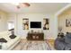 Living room with hardwood floors, a media center, and comfortable seating at 6722 Boulder Run Loop, Wesley Chapel, FL 33545