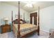 Warm and inviting main bedroom featuring a four poster bed, side tables, and neutral colors at 6722 Boulder Run Loop, Wesley Chapel, FL 33545