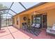 Inviting screened-in patio with stylish furniture and peaceful outdoor space at 6722 Boulder Run Loop, Wesley Chapel, FL 33545