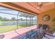 Relaxing screened patio with comfortable seating and serene water view at 6722 Boulder Run Loop, Wesley Chapel, FL 33545