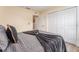 Simple bedroom with gray bedding and ample closet space at 734 Fortuna Dr, Brandon, FL 33511