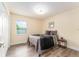 Cozy bedroom with gray bedding and a window allowing natural light at 734 Fortuna Dr, Brandon, FL 33511