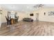 Open concept dining area with a rustic wooden table at 734 Fortuna Dr, Brandon, FL 33511